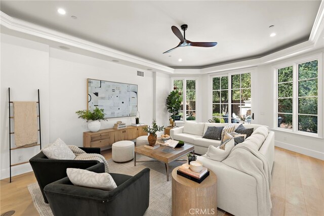 6 Rickie, Ladera Ranch, CA 92694 - living room featuring a tray ceiling, a ceiling fan, light wood-style flooring, healthy amount of natural light, and recessed lighting