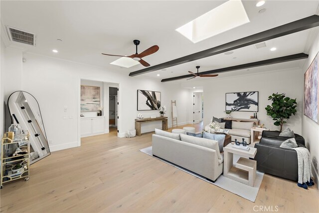 6 Rickie, Ladera Ranch, CA 92694 - living area with a ceiling fan, light wood-style flooring, a skylight, recessed lighting, and beam ceiling