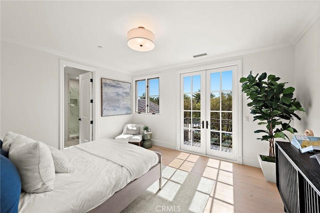 6 Rickie, Ladera Ranch, CA 92694 - bedroom featuring access to outside, french doors, ornamental molding, ensuite bath, and light wood-style floors