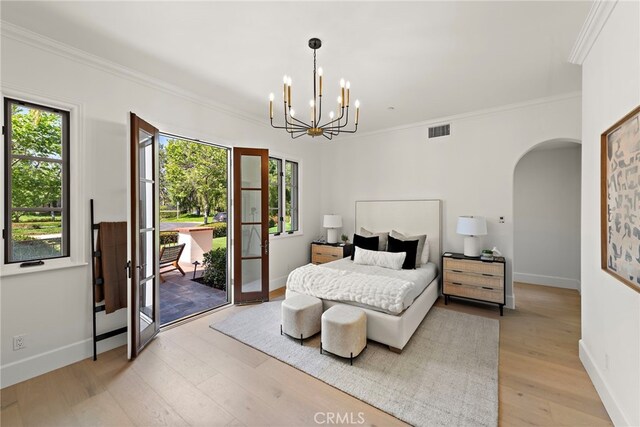 6 Rickie, Ladera Ranch, CA 92694 - bedroom featuring arched walkways, ornamental molding, multiple windows, light wood-style flooring, and access to outside
