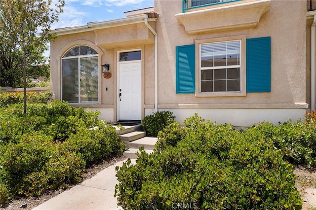 27861 Crown Court Cir Unit 72, Valencia, CA 91354 - view of exterior entry featuring stucco siding