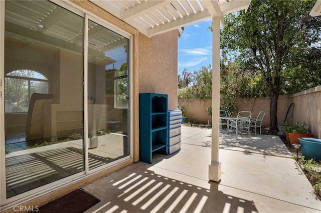 27861 Crown Court Cir Unit 72, Valencia, CA 91354 - fenced backyard with a patio area, a pergola, and outdoor dining space