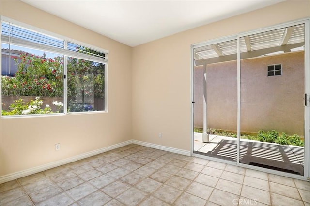 27861 Crown Court Cir Unit 72, Valencia, CA 91354 - spare room featuring baseboards and tile patterned floors