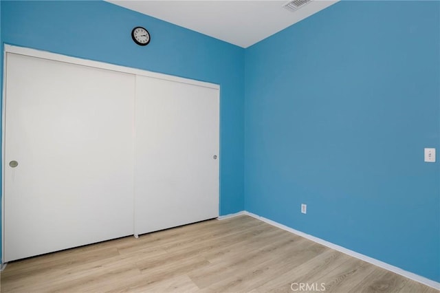 27861 Crown Court Cir Unit 72, Valencia, CA 91354 - unfurnished bedroom featuring wood finished floors and a closet