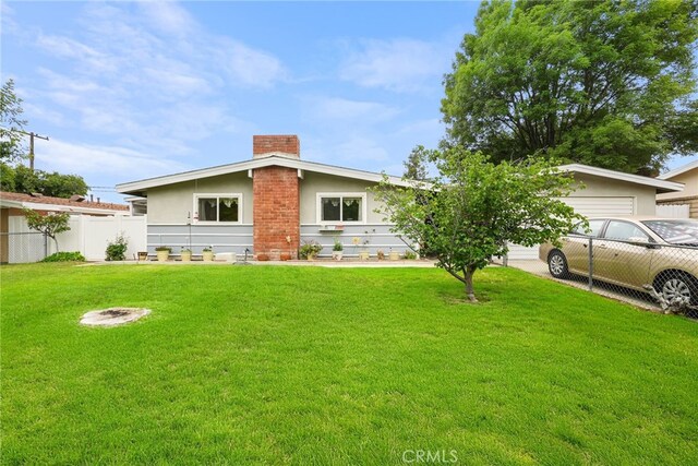 27439 Santa Clarita Rd, Saugus, CA 91350 - view of front of home with a chimney, stucco siding, and an attached garage