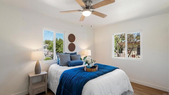 846 44th St, San Diego, CA 92102 - bedroom featuring multiple windows, wood finished floors, and a ceiling fan