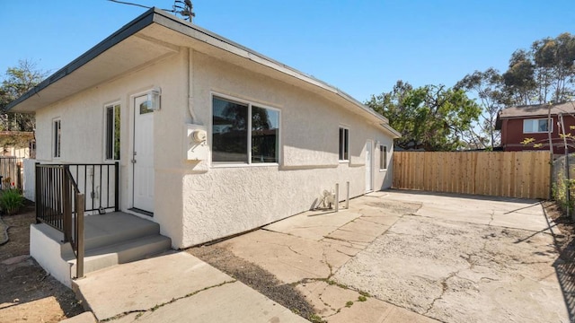 846 44th St, San Diego, CA 92102 - view of side of home featuring stucco siding and a patio
