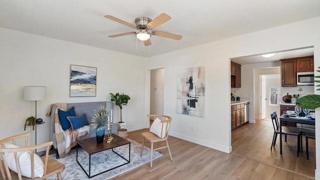 846 44th St, San Diego, CA 92102 - living area with light wood-style floors and ceiling fan