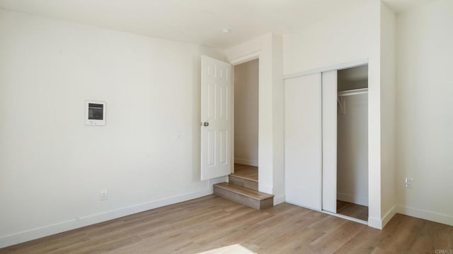 846 44th St, San Diego, CA 92102 - unfurnished bedroom with light wood-style flooring and a closet