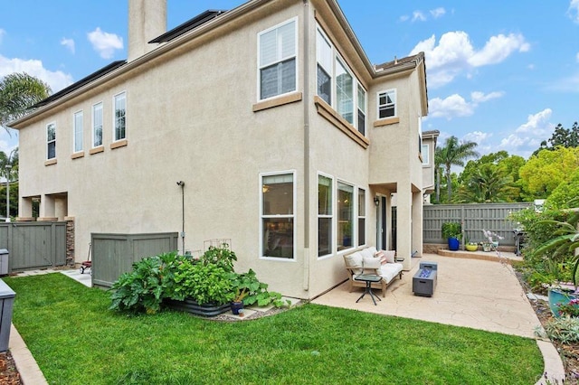 1488 Enchante, Oceanside, CA 92056 - back of house with stucco siding, a fenced backyard, a patio, and a chimney