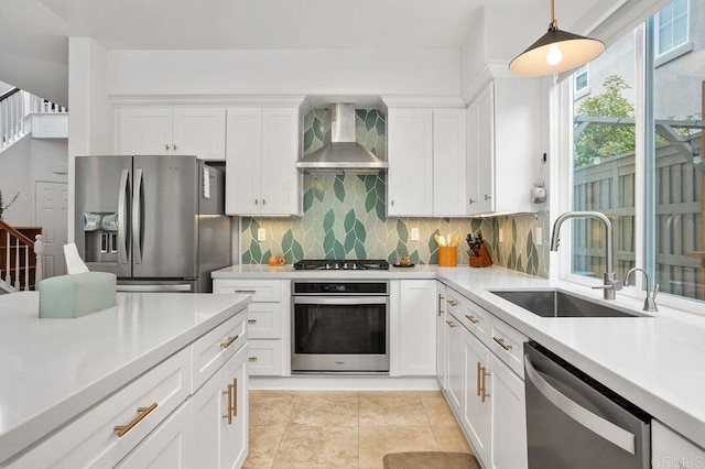 1488 Enchante, Oceanside, CA 92056 - kitchen featuring stainless steel appliances, wall chimney exhaust hood, light countertops, tasteful backsplash, and white cabinets