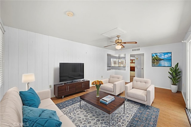 25925 Roanoke Rd, Menifee, CA 92586 - living area with attic access, light wood-style flooring, and a ceiling fan