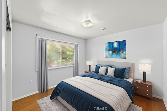 25925 Roanoke Rd, Menifee, CA 92586 - bedroom with wood finished floors and baseboards