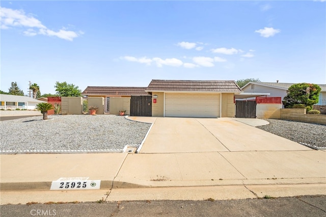 25925 Roanoke Rd, Menifee, CA 92586 - view of front of home featuring driveway and an attached garage