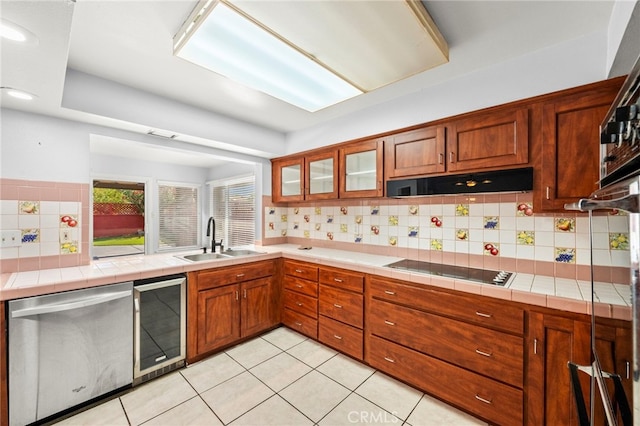 25925 Roanoke Rd, Menifee, CA 92586 - kitchen featuring stainless steel dishwasher, wine cooler, black electric stovetop, exhaust hood, and backsplash