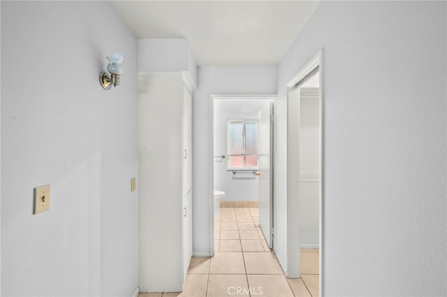 25925 Roanoke Rd, Menifee, CA 92586 - corridor with light tile patterned floors and baseboards
