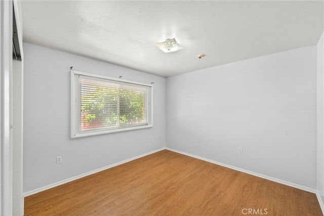 25925 Roanoke Rd, Menifee, CA 92586 - unfurnished room featuring wood finished floors and baseboards