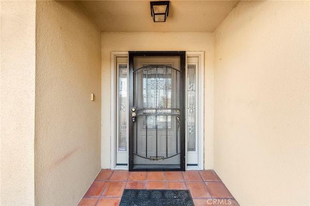25925 Roanoke Rd, Menifee, CA 92586 - doorway to property with stucco siding