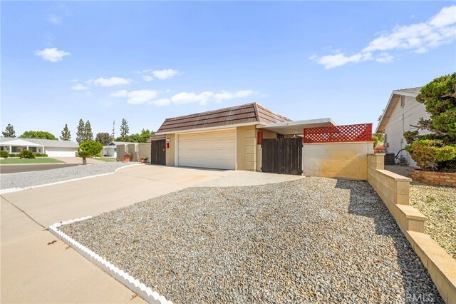 25925 Roanoke Rd, Menifee, CA 92586 - view of front facade featuring concrete driveway and mansard roof