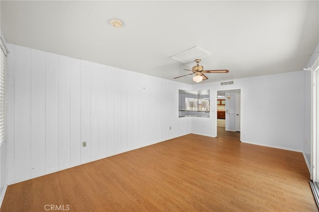 25925 Roanoke Rd, Menifee, CA 92586 - spare room featuring light wood finished floors, a smoke detector, a ceiling fan, and attic access