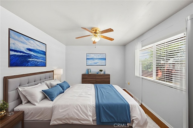 25925 Roanoke Rd, Menifee, CA 92586 - bedroom with wood finished floors and a ceiling fan