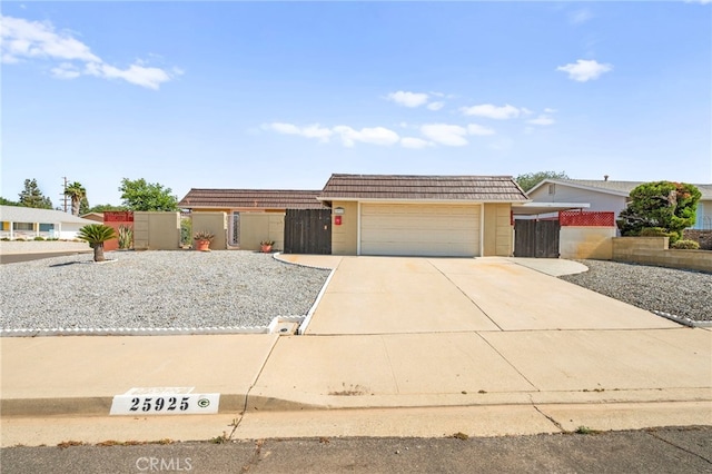 25925 Roanoke Rd, Menifee, CA 92586 - view of front of house with driveway and a garage