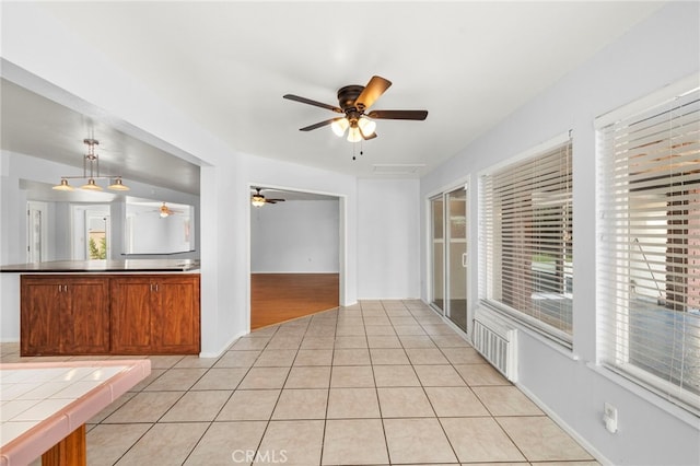 25925 Roanoke Rd, Menifee, CA 92586 - kitchen featuring ceiling fan, plenty of natural light, and light tile patterned flooring