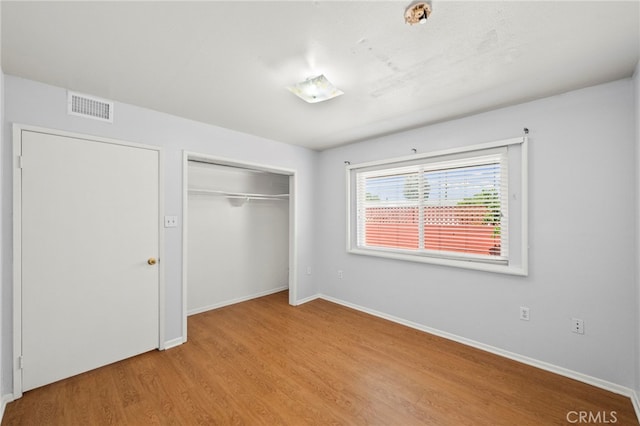 25925 Roanoke Rd, Menifee, CA 92586 - unfurnished bedroom with light wood-type flooring and a closet