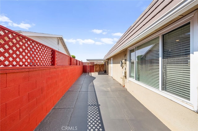 25925 Roanoke Rd, Menifee, CA 92586 - view of side of property featuring a fenced backyard, stucco siding, and a patio