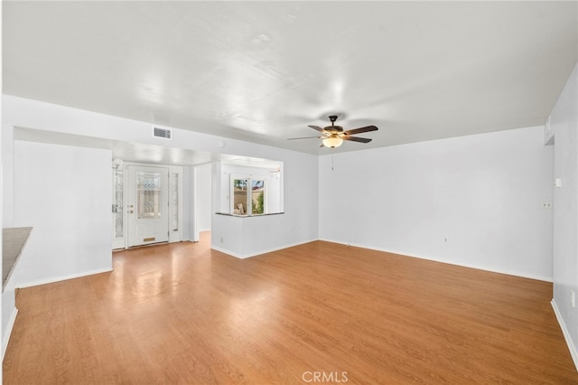 25925 Roanoke Rd, Menifee, CA 92586 - unfurnished living room with ceiling fan and light wood-style floors