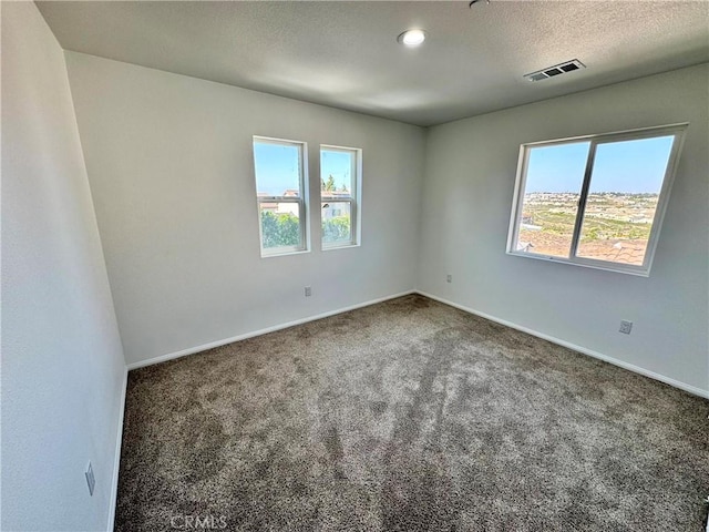 13105 Via Tuscany, Riverside, CA 92503 - empty room with healthy amount of natural light, carpet flooring, and a textured ceiling