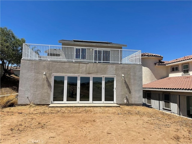 13105 Via Tuscany, Riverside, CA 92503 - rear view of property featuring a balcony and stucco siding