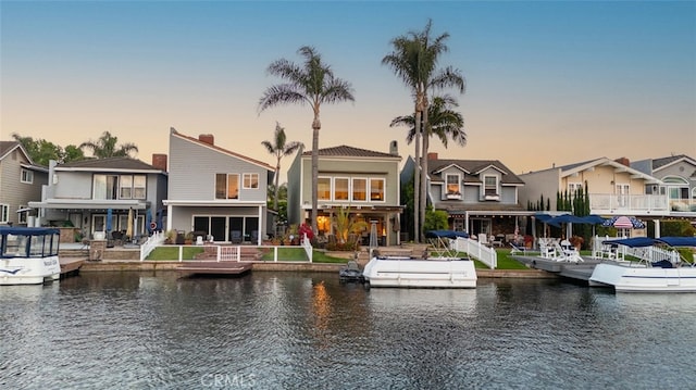 21891 Winnebago Ln, Lake Forest, CA 92630 - back of house featuring a water view and a residential view