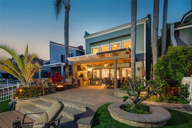21891 Winnebago Ln, Lake Forest, CA 92630 - back of house featuring a patio area, an outdoor fire pit, a pergola, and area for grilling
