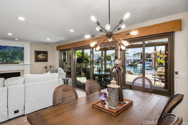 21891 Winnebago Ln, Lake Forest, CA 92630 - dining space with a chandelier, recessed lighting, wood finished floors, and a water view