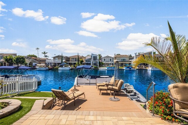 21891 Winnebago Ln, Lake Forest, CA 92630 - view of swimming pool with a residential view, a water view, a dock, and a swimming pool