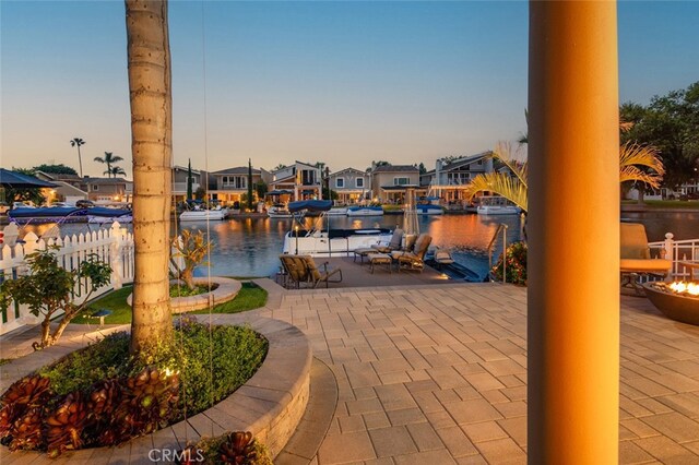 21891 Winnebago Ln, Lake Forest, CA 92630 - view of patio featuring a boat dock, an outdoor fire pit, a water view, and a residential view
