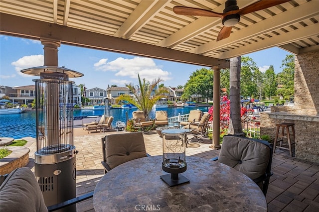 21891 Winnebago Ln, Lake Forest, CA 92630 - view of patio / terrace featuring outdoor dining space, a ceiling fan, a water view, and an outdoor pool