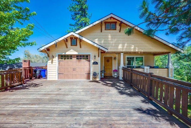 163 Wylerhorn Dr, Crestline, CA 92325 - view of front of house featuring an attached garage, concrete driveway, and a deck