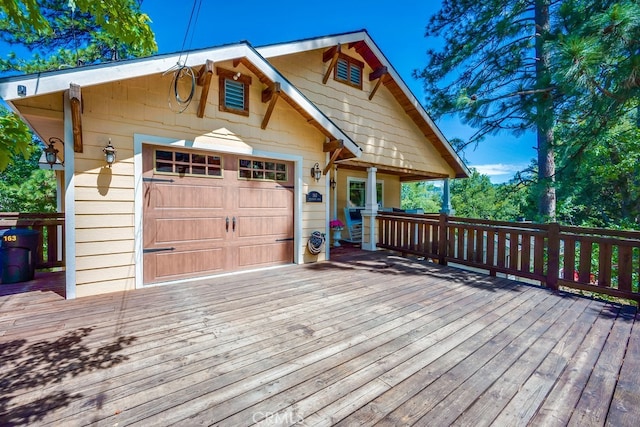 163 Wylerhorn Dr, Crestline, CA 92325 - view of front of house featuring a wooden deck and an attached garage