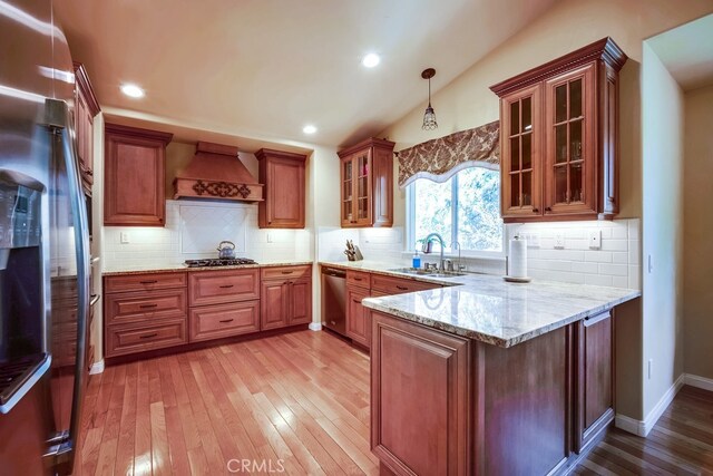 163 Wylerhorn Dr, Crestline, CA 92325 - kitchen with custom range hood, stainless steel appliances, a peninsula, light stone countertops, and light wood-type flooring