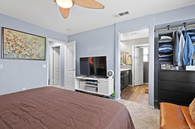 2128 Cantata # 38, Chula Vista, CA 91914 - bedroom with wood finished floors, a ceiling fan, and ensuite bathroom
