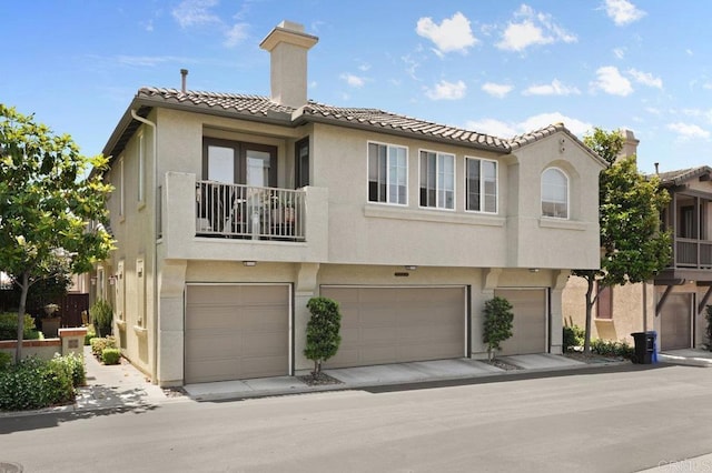2128 Cantata # 38, Chula Vista, CA 91914 - multi unit property with a tiled roof, an attached garage, stucco siding, and a chimney