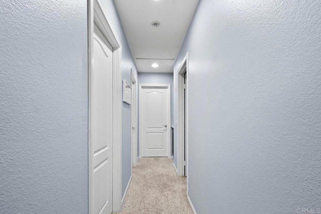 2128 Cantata # 38, Chula Vista, CA 91914 - hallway with light carpet, a textured wall, and recessed lighting