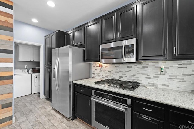 2128 Cantata # 38, Chula Vista, CA 91914 - kitchen featuring stainless steel appliances, separate washer and dryer, dark cabinets, backsplash, and recessed lighting
