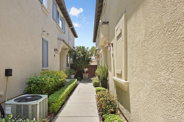 2128 Cantata # 38, Chula Vista, CA 91914 - view of side of home with stucco siding and a cooling unit