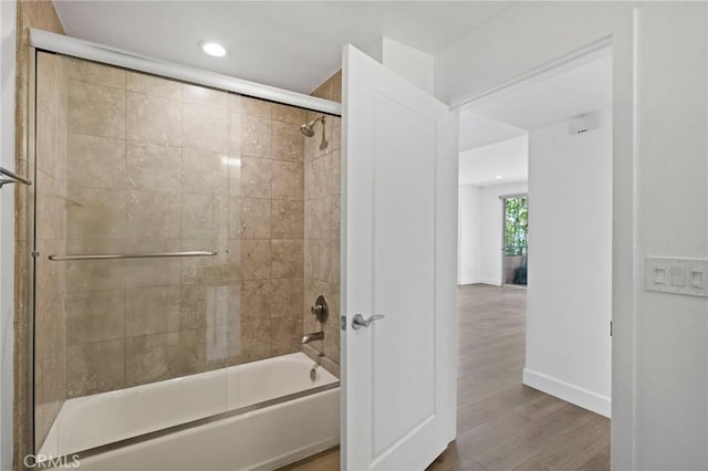 2010 S Beverly Glen Blvd Unit 103, Los Angeles, CA 90025 - full bath with shower / bath combination with glass door, wood finished floors, and recessed lighting