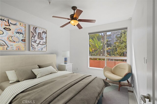 2010 S Beverly Glen Blvd Unit 103, Los Angeles, CA 90025 - bedroom with wood finished floors and a ceiling fan