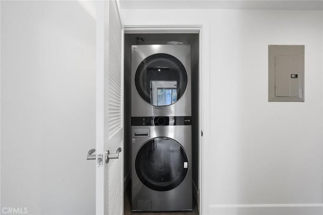 2010 S Beverly Glen Blvd Unit 103, Los Angeles, CA 90025 - laundry room featuring electric panel and stacked washer / dryer