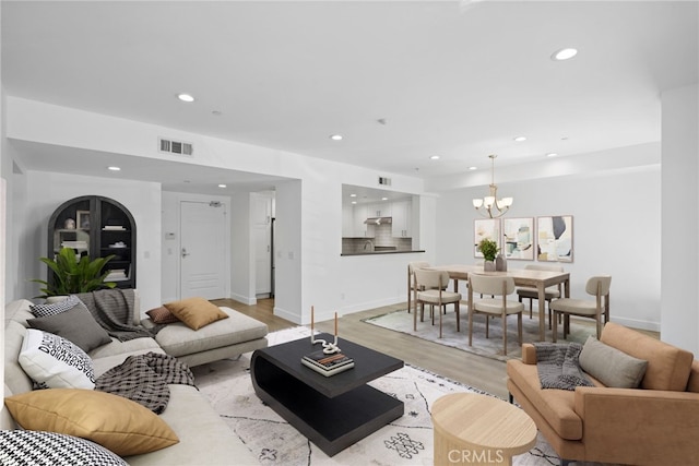 2010 S Beverly Glen Blvd Unit 103, Los Angeles, CA 90025 - living area featuring recessed lighting, a chandelier, and light wood-type flooring